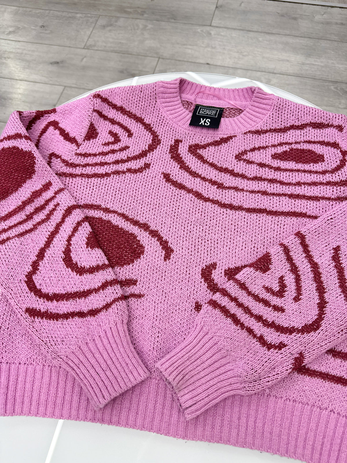 Buzo rosado Piece of Cake talle XS