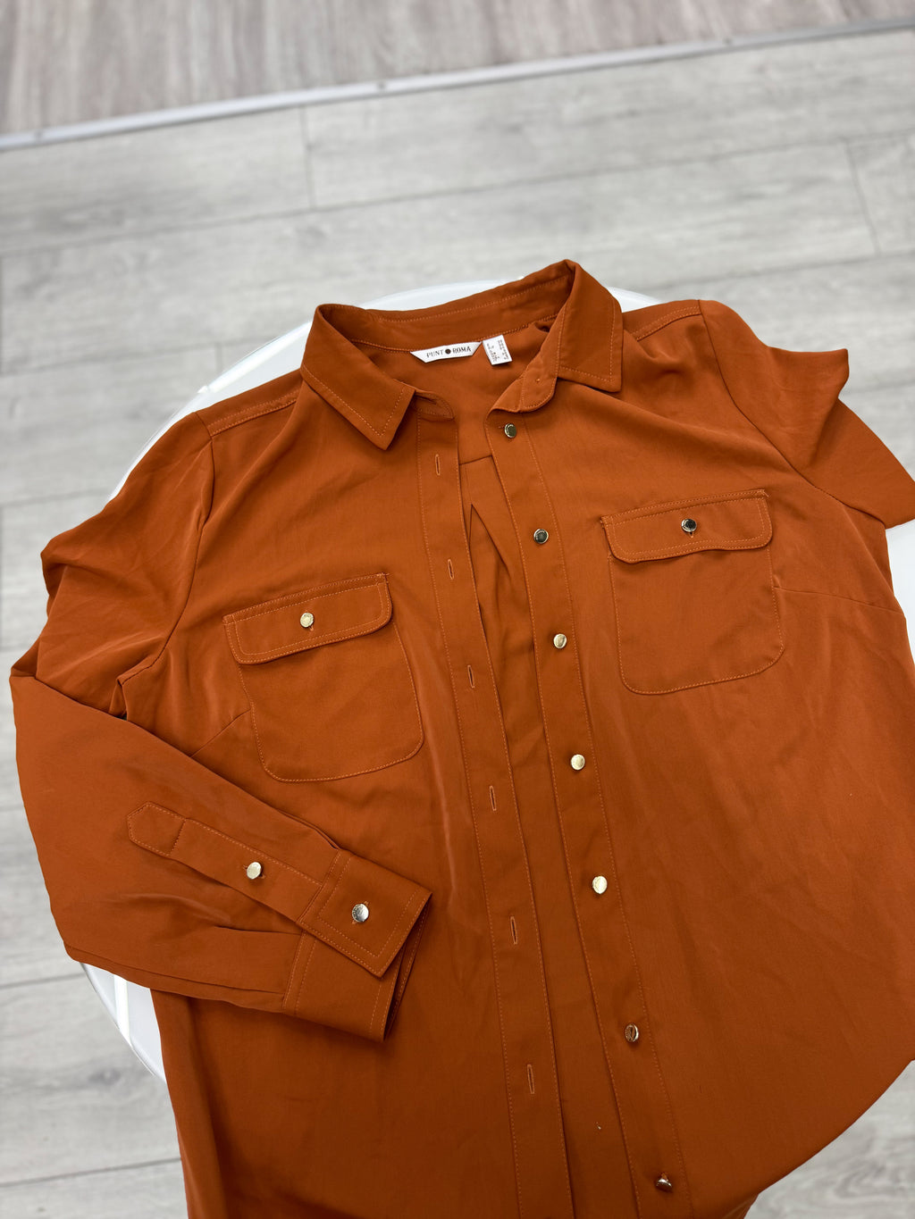 Camisa color terracota talle M
