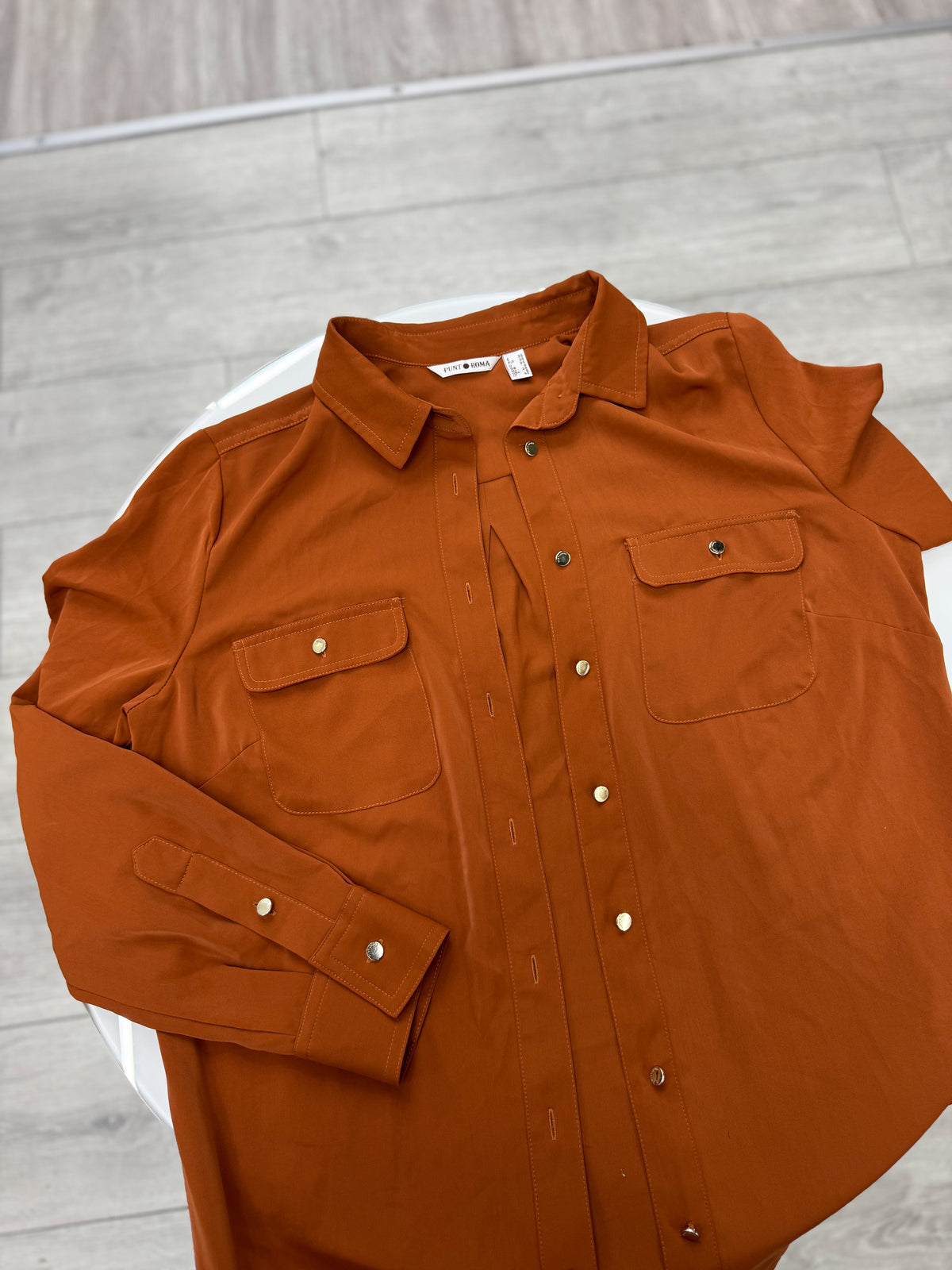 Camisa color terracota talle M