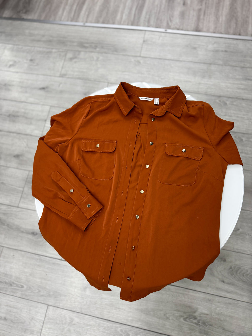 Camisa color terracota talle M