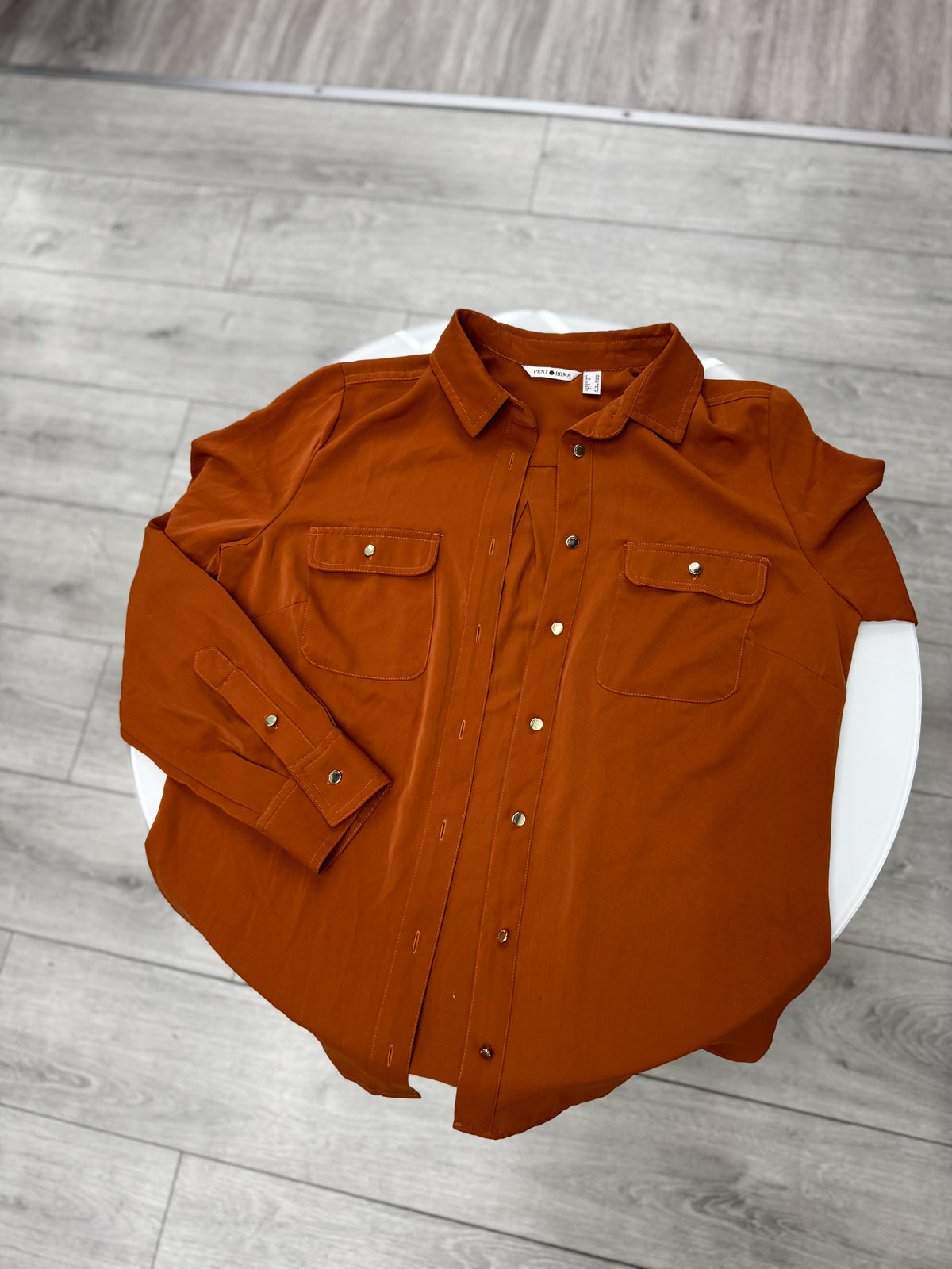Camisa color terracota talle M