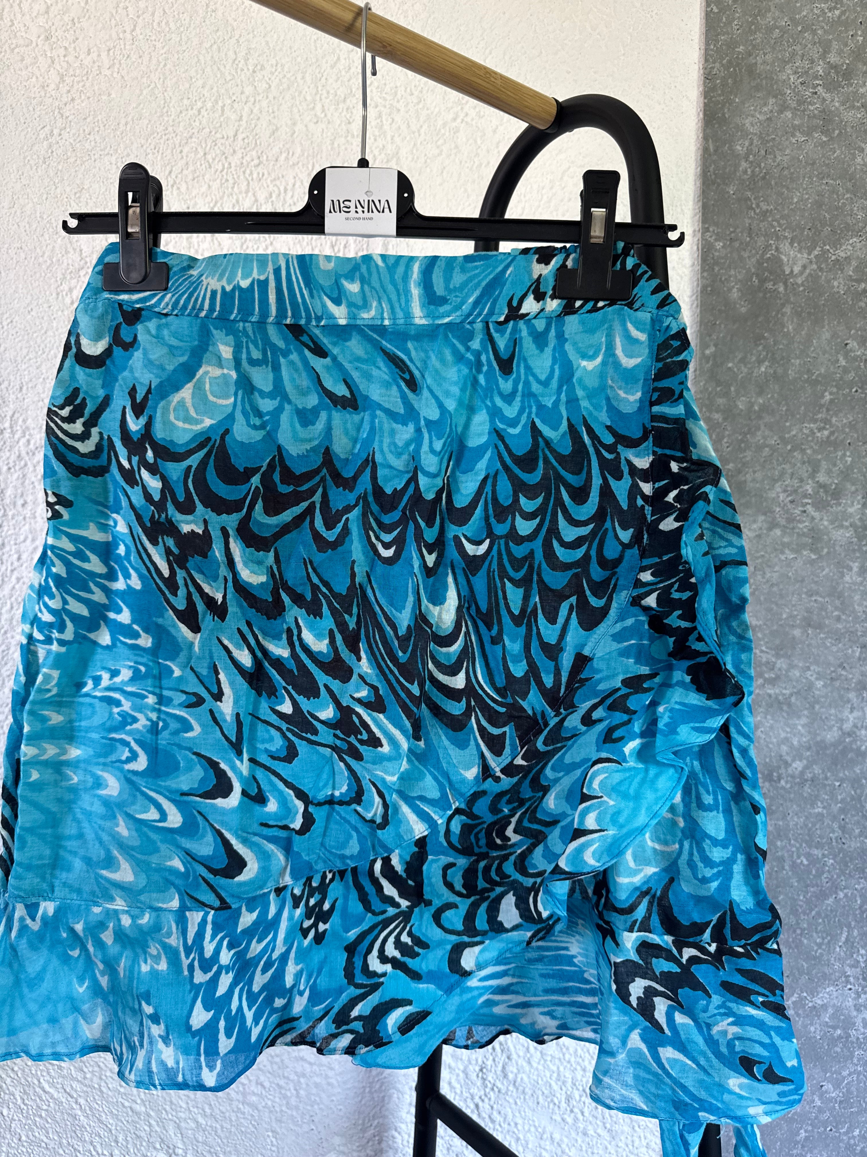 Pollera celeste cruzada con diseño